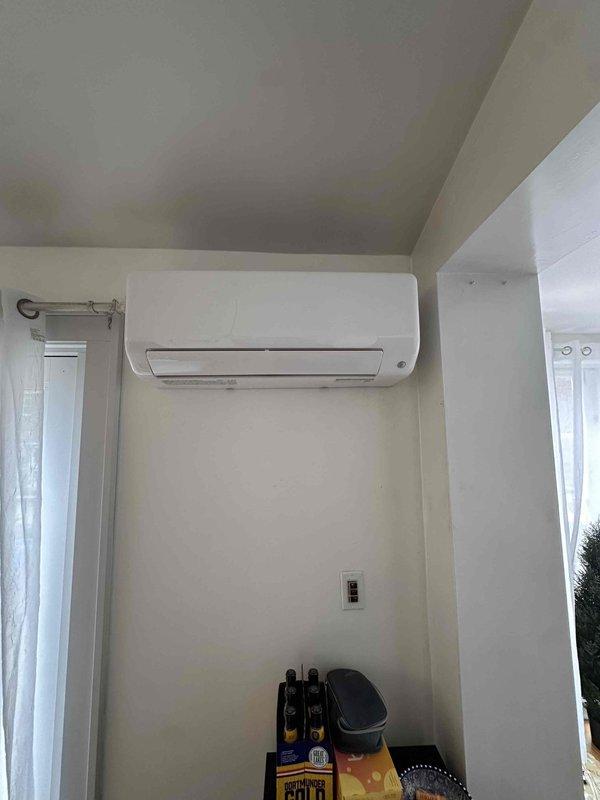 Completed full ductwork replacement in attic including all supply ductwork with 10 supply outlets and return air ductwork to address damaged sections. Replaced refrigerant line insulation that had been compromised by animal damage. Installed new Bryant ductless mini-split heat pump system for kitchen with indoor wall-mounted evaporator unit and outdoor condenser unit wall-mounted adjacent to existing mini-split condenser on exterior brick ledge.