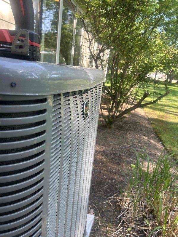 Responded to service call for 9-year-old Ruud central air conditioning system unable to cool below 75 degrees despite recently changed filter. Performed diagnostic evaluation of outdoor condenser unit using digital measurement tools to assess system performance and identify cooling deficiency. Inspected condenser components, verified unit operation, and tested refrigerant levels and airflow to determine cause of inadequate cooling capacity.