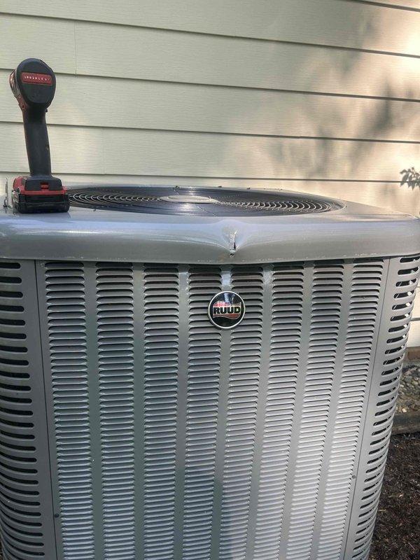 Responded to service call for 9-year-old Ruud central air conditioning system unable to cool below 75 degrees despite recently changed filter. Performed diagnostic evaluation of outdoor condenser unit using digital measurement tools to assess system performance and identify cooling deficiency. Inspected condenser components, verified unit operation, and tested refrigerant levels and airflow to determine cause of inadequate cooling capacity.