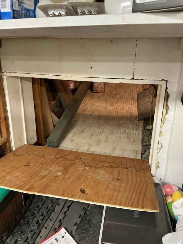 Conducted on-site assessment for mini split installation in residential space with vaulted ceiling and existing window air conditioning unit. Evaluated interior room layout, electrical access points, and attic space accessibility for potential indoor air handler and outdoor condenser placement. Documented current cooling system configuration and structural considerations including exposed beam construction and available mounting locations for optimal mini split system installation.