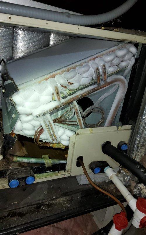 Responded to no cooling call on 4-year-old York system with outdoor condensing unit and attic-mounted air handler. Upon inspection, found evaporator coil completely frozen with heavy ice accumulation covering copper tubing and refrigerant lines. Identified restricted airflow as primary cause due to dirty air filter located in attic access area. System was shut down to allow coil to thaw completely. Replaced air filter and verified proper airflow upon restart. Checked refrigerant pressures, confirmed adequate charge levels, and inspected condensate drain line for proper operation. System restored to normal cooling operation with proper temperature differential across coil. Advised on importance of regular filter maintenance to prevent future freeze-ups.