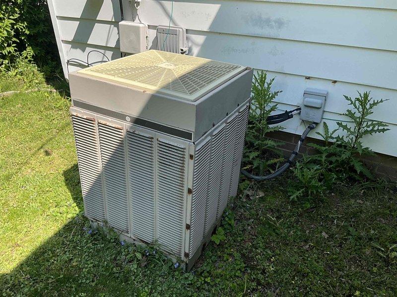Conducted comprehensive on-site evaluation for complete HVAC system replacement. Assessed existing air handler unit located in basement mechanical room with connected bedroom ductwork, and inspected outdoor condenser unit showing significant weathering and age-related deterioration. Documented current system configuration, refrigerant line routing, electrical connections, and provided replacement recommendations for 11-12 SEER rated equipment upgrade.