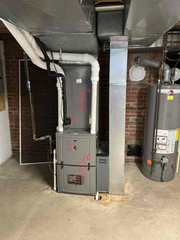 Performed comprehensive assessment of 4-year-old residential HVAC system experiencing refrigerant leak. Inspected outdoor condensing unit and indoor air handler in basement mechanical room, documented equipment specifications and current operating conditions, and provided detailed replacement estimate for complete system upgrade due to active leak and unit age considerations.