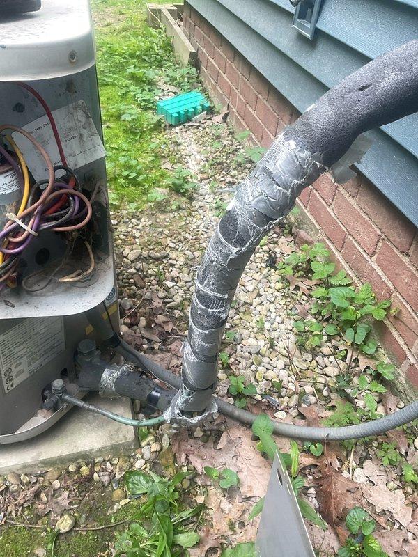 Responded to no cooling complaint on 30-year-old air conditioning system. Upon arrival, performed diagnostic evaluation of outdoor condensing unit. Inspected electrical components within service panel, including capacitor, contactor, and associated wiring connections. Examined refrigerant line insulation and connection points for signs of degradation. Noted significant rust and corrosion present in exterior electrical disconnect box, indicating prolonged exposure to moisture and potential electrical safety concerns. Documented equipment condition with photographs showing aged refrigerant lines with multiple repair attempts, deteriorated insulation, and compromised electrical enclosure. Given the advanced age of the system and extent of component deterioration observed, provided customer with assessment of current equipment condition and discussed available repair versus replacement options for their consideration.
