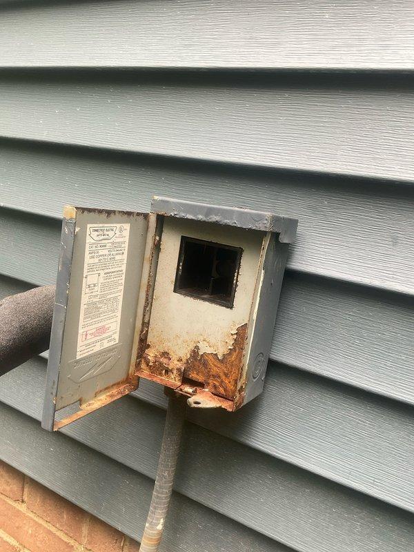 Responded to no cooling complaint on 30-year-old air conditioning system. Upon arrival, performed diagnostic evaluation of outdoor condensing unit. Inspected electrical components within service panel, including capacitor, contactor, and associated wiring connections. Examined refrigerant line insulation and connection points for signs of degradation. Noted significant rust and corrosion present in exterior electrical disconnect box, indicating prolonged exposure to moisture and potential electrical safety concerns. Documented equipment condition with photographs showing aged refrigerant lines with multiple repair attempts, deteriorated insulation, and compromised electrical enclosure. Given the advanced age of the system and extent of component deterioration observed, provided customer with assessment of current equipment condition and discussed available repair versus replacement options for their consideration.