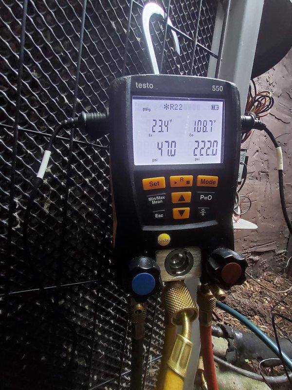 Responded to service call for 11-year-old air conditioning system reported as not running with no cooling and excessive condensation buildup on refrigerant lines. Upon arrival, performed diagnostic evaluation using digital manifold gauges on R22 system. Measured operating pressures and temperatures, recording suction pressure at 48.5 psi with superheat of 68°F and discharge pressure at 241.0 psi with subcooling of 296°F on initial readings. Conducted secondary pressure analysis showing 470 psi and 222.0 psi with temperature readings of 23°F and 10.8°F. Observed significant condensation accumulation on refrigerant line set as reported. System was found running at time of service. Documented system conditions with digital pressure/temperature readings for service records.