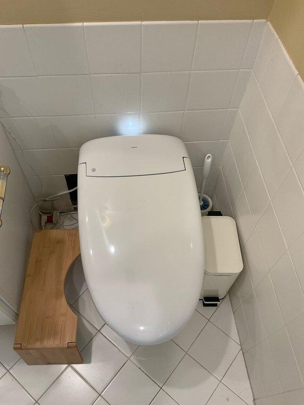 Completed installation of customer-supplied toilet in residential bathroom. Removed existing toilet fixture, prepared flange and wax ring seal, set new toilet unit, secured to floor, connected water supply line, and tested for proper operation and leaks. All plumbing connections verified and functional upon completion.
