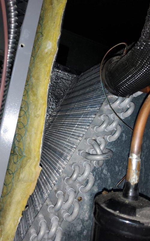 Responded to service call for 9-year-old central air conditioning system experiencing uneven cooling throughout the home with reduced efficiency. Upon inspection, discovered significant dust and debris accumulation on the evaporator coil fins, restricting airflow and reducing heat transfer capacity. Thoroughly cleaned evaporator coil using appropriate methods to restore optimal airflow and heat exchange performance. Inspected refrigerant lines, insulation, and condensate drainage system for proper operation. Verified all electrical connections and motor components were functioning correctly. System tested after service completion, confirming improved airflow distribution and cooling efficiency restored to normal operating parameters.