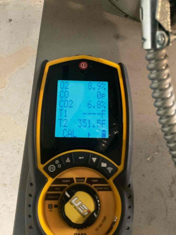 Performed comprehensive heating system maintenance on residential boiler unit located in basement mechanical room. Conducted thorough inspection of boiler cabinet, piping configuration, and associated components including expansion tank, copper supply lines, and isolation valves. Utilized combustion analyzer to test system performance, recording flue gas temperature of 351.5°F, oxygen level of 8.92%, carbon monoxide at 0 ppm, and carbon dioxide at 6.82%. All combustion readings within acceptable parameters indicating proper burner operation and heat exchanger efficiency. Visually inspected all pipe connections, fittings, and valves for signs of leaks or corrosion. Verified proper operation of circulator pump and zone valves. Confirmed expansion tank mounting and pre-charge pressure. System operating safely and efficiently with no deficiencies noted.