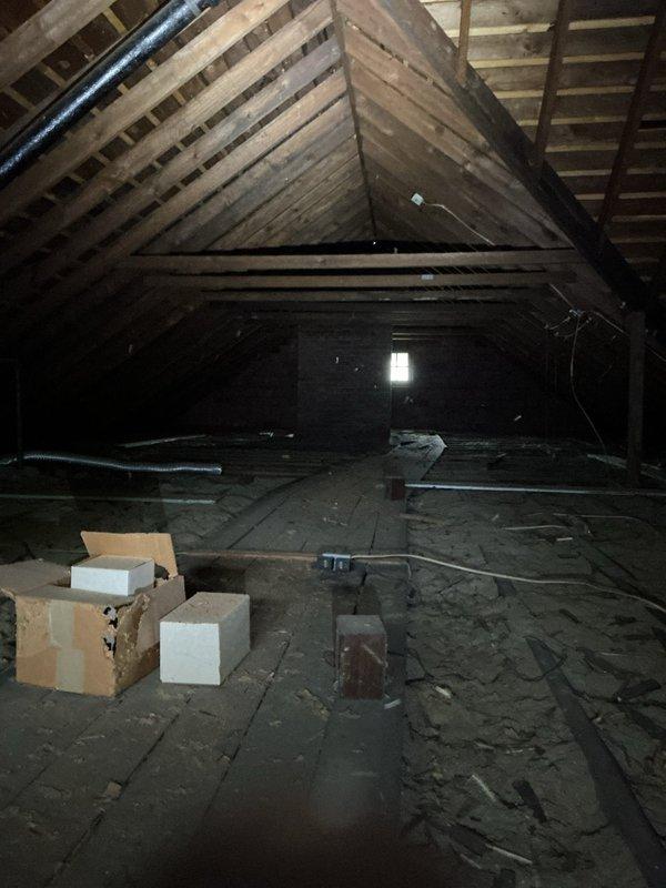 Conducted on-site assessment for mini split installation in residential property. Evaluated attic space for equipment placement and line set routing, documenting existing conditions including exposed roof structure, accessible floor joists, and current storage configuration. Inspected ceiling access panel and verified structural integrity for potential indoor unit mounting locations. Photographed installation areas to develop accurate equipment sizing recommendations and determine optimal placement for both indoor air handler and outdoor condensing unit connections.