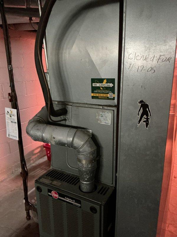 Completed HVAC system replacement estimate for existing Rheem furnace and air handler unit installed in basement utility room. Documented current equipment configuration including ductwork connections and system specifications to provide accurate replacement recommendations for aging system originally installed in 2005.