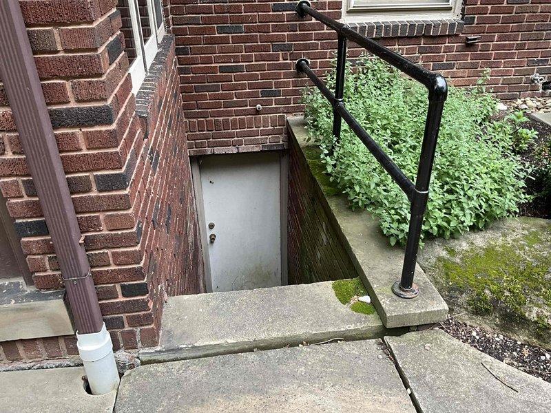 Performed routine air conditioner tune-up on residential HVAC system located in basement mechanical room. Accessed unit via exterior basement entrance, conducted comprehensive inspection of AC components, verified system operation, and documented equipment condition through photographic records. No issues identified during inspection; system operating within normal parameters.