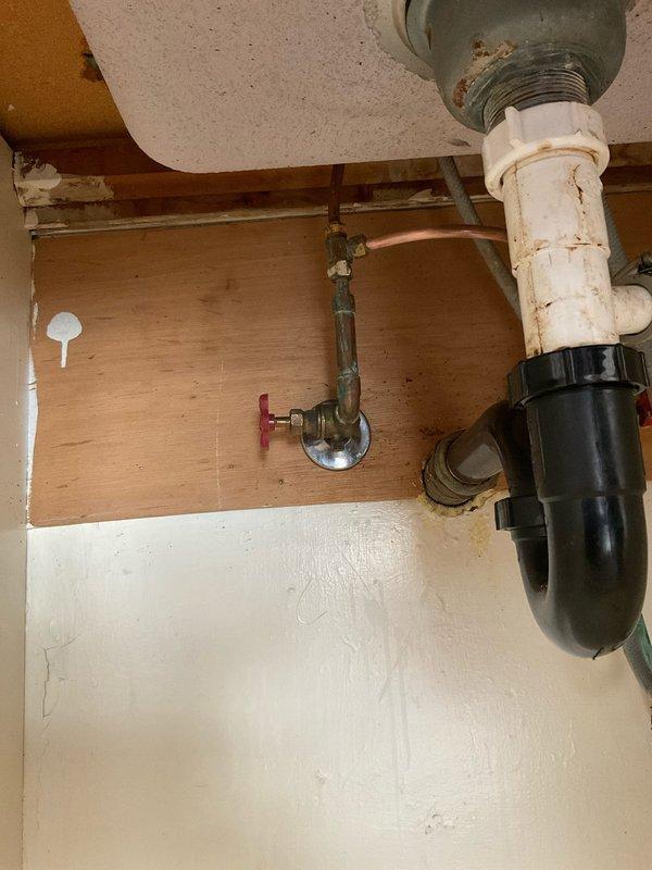 Responded to service call for installation of shut-off valves on copper supply lines. The existing copper tubing was soldered without individual fixture isolation valves. Installed new shut-off valves with wheel handles on hot water supply lines serving kitchen and bathroom fixtures. Valves were properly labeled with identification tags indicating "Kitchen Hot" and "Bathroom Hot" for easy identification. Applied foam pipe insulation to two of the supply lines to prevent heat loss and condensation. All connections were secured and tested for proper operation and leak-free performance, providing individual shut-off capability for each fixture zone.