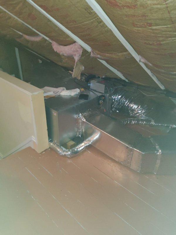 Responded to service call for 9-year-old central air conditioning system with Unico ductwork that was unable to cool residence below 76 degrees despite extended runtime. Upon arrival, accessed attic-mounted air handler and inspected system components including ductwork and refrigerant levels. Performed refrigerant charge verification using calibrated Fieldpiece scale, identifying system was low on refrigerant charge at 5 pounds 8 ounces. Added refrigerant to manufacturer specifications, verified proper system operation, and confirmed adequate cooling capacity restored to unit.