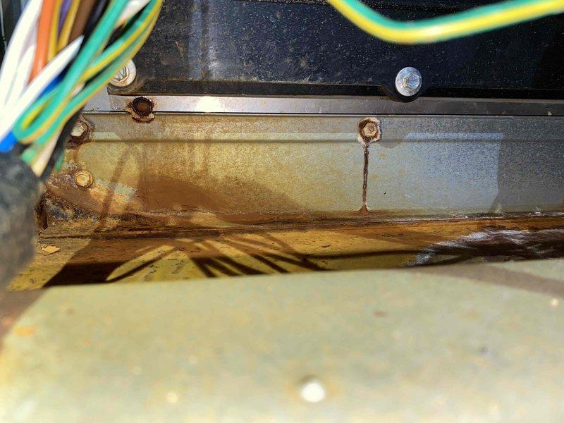 Completed scheduled heating maintenance visit on R-410A system. Upon inspection, discovered significant rust and corrosion on interior metal components, including drain pan and condensate tray, indicating prolonged moisture exposure. Performed comprehensive refrigerant diagnostics using digital gauge system, recording suction side pressure at 99.2 psig with 33.2°F temperature and 2.3°F actual superheat, and liquid side pressure at 296.2 psig with 69.4°F temperature and 25.5°F actual subcooling. System operating within acceptable parameters despite visible deterioration of internal components.