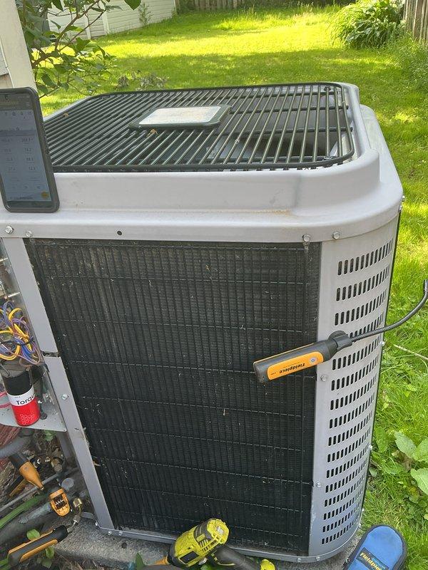 Performed comprehensive AC tune-up on residential cooling system with air handler located in attic. Completed full system inspection including electrical connections, refrigerant lines, and condenser unit operation. Verified proper refrigerant pressures, cleaned condenser coils, checked all electrical wiring and connections for secure operation, and confirmed system functionality with no issues identified during maintenance visit.