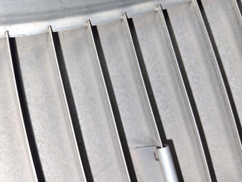 Completed spring maintenance on a 4-year-old air conditioning system. Inspected condenser coil fins, which were found to be in good condition with no significant damage or corrosion, and recorded ambient temperature reading of 74.4°F during service. All components checked and system operational.