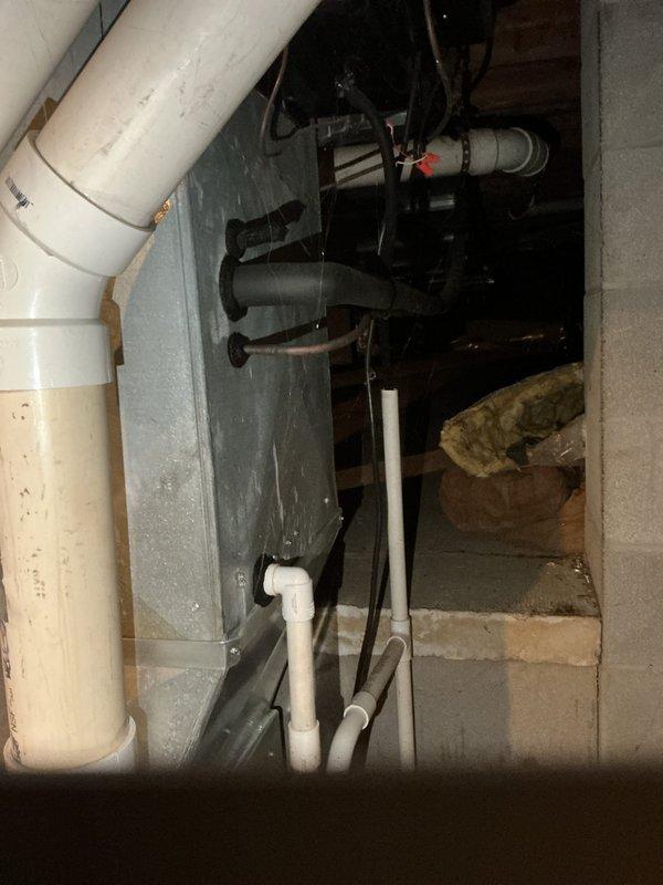 Responded to service call for non-operational air conditioning unit serving first floor master suite. Conducted thorough assessment of existing HVAC system located in basement mechanical room, including furnace and associated ductwork. Documented current equipment configuration, noting furnace unit with PVC exhaust/intake venting, condensate drainage system, and related mechanical components. Provided comprehensive estimate for complete system replacement to restore cooling capability to affected zone.