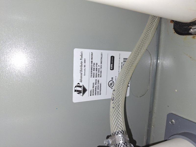 Completed preventive maintenance tune-up on a 10+ year old Goodman air conditioning system. Performed comprehensive inspection of unit components, verified manufacturer specifications and safety labels, examined refrigerant lines and connections for proper condition, and documented equipment information including model number DXXV1DHU1V619. All components found to be in satisfactory operating condition with no immediate repairs required.
