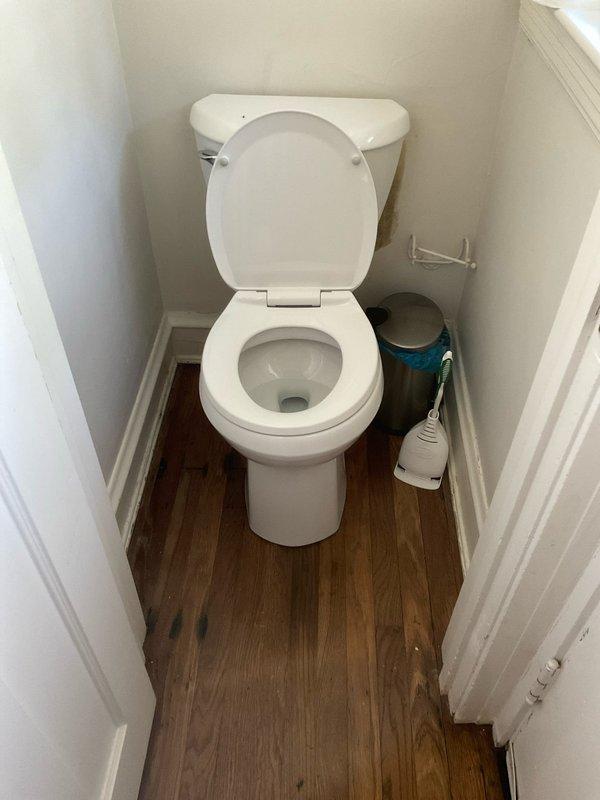 Completed installation of customer-supplied American Standard toilet in small bathroom. Removed existing fixture and prepared floor flange connection. Installed new toilet, ensuring proper sealing at the base and secure mounting to floor. Verified proper operation of fill valve, flush mechanism, and drainage. No warranty provided on this installation as customer supplied the fixture.