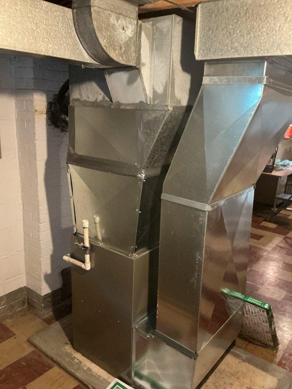 Completed full HVAC system replacement for 21-year-old air conditioning unit. Installed new outdoor condenser unit on existing concrete pad at exterior of residence and replaced indoor air handler in basement utility area with updated equipment. Connected new ductwork, condensate drain lines, and electrical components to ensure proper system operation and code compliance.