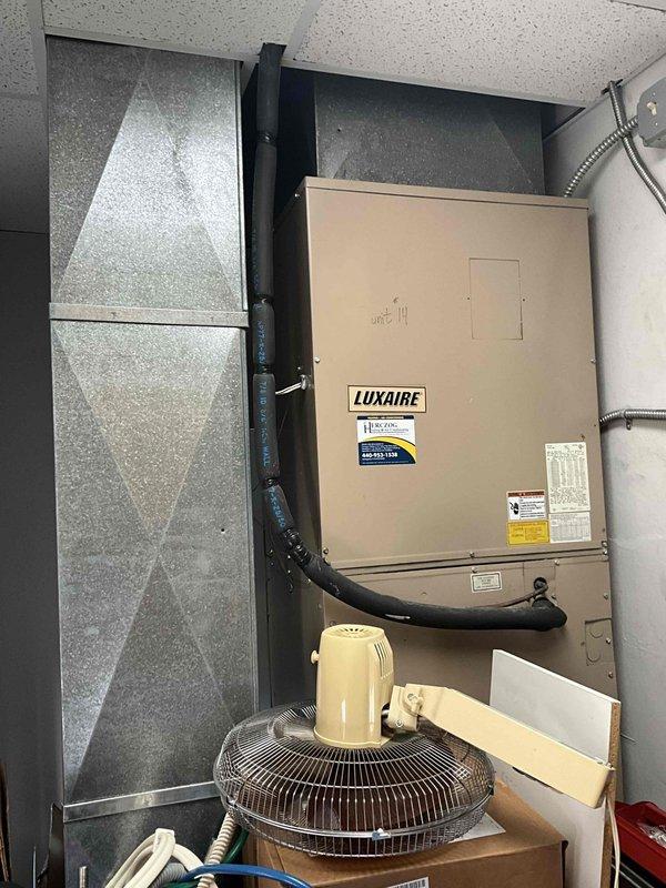 Responded to commercial facility for HVAC equipment replacement estimate. Assessed multiple existing Luxaire heating and cooling units located in interior mechanical rooms and utility closets. Evaluated current system configurations, ductwork connections, condensate drainage systems, and spatial constraints for potential replacement of three HVAC units. Documented existing equipment conditions, manufacturer specifications, and installation parameters through comprehensive site photography to support equipment sizing and replacement recommendations.