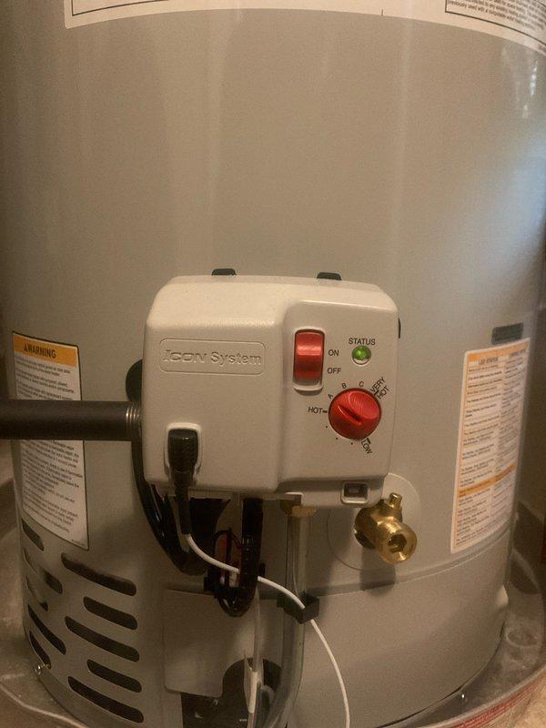 Installed a Bradford White RG1PV40S6N 40-gallon natural gas power vent water heater with 40,000 BTU/hr heating capacity and 43 gph recovery rate. Replaced the existing expansion tank with a new unit, properly mounted to the wall and connected via copper piping to the water heater system. All brass fittings, valves, and connections were secured to ensure proper operation of both the water heater and expansion tank within the residential mechanical system.