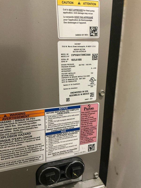 Completed preventative maintenance inspection on two residential cooling systems. First unit, a Carrier R-410A heat pump model CVPU/42417XMCAAA, was inspected with all manufacturer labels and service ports documented in good condition. Second unit exhibited significant evaporator coil icing, indicating potential airflow restriction, low refrigerant charge, or metering device malfunction requiring further diagnostic evaluation and corrective action.