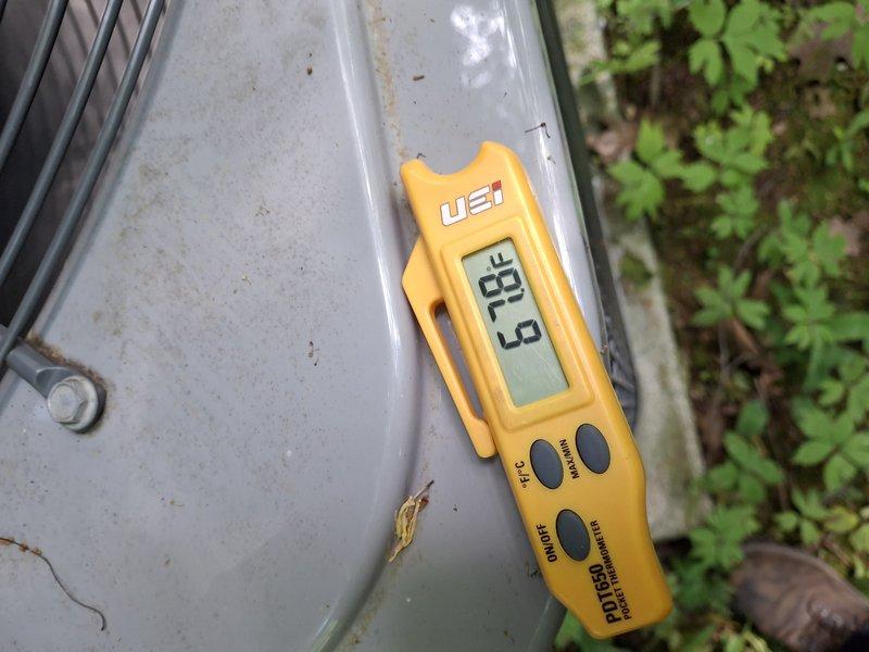 Performed routine maintenance inspection on 8-year-old Fujitsu split-type air conditioning system. Measured and recorded operating temperatures using calibrated digital thermometer, with outdoor unit reading 33.9°F, and verified all system components were functioning within manufacturer specifications.