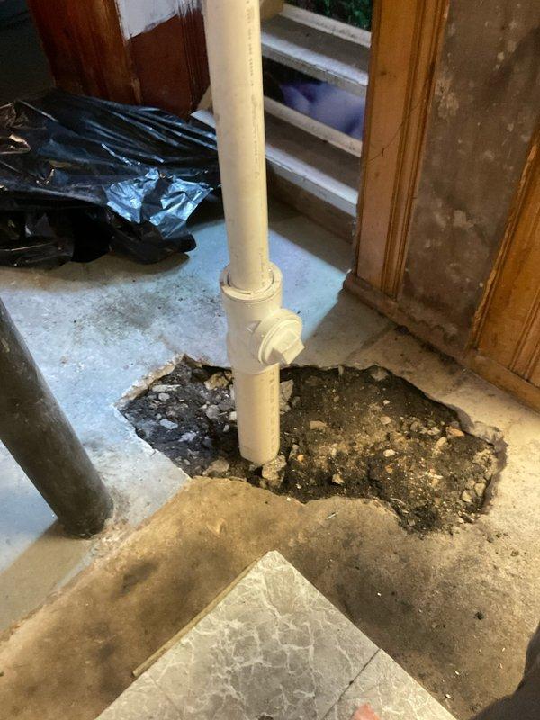 Replaced deteriorated plumbing stack with new PVC pipe where severe concrete floor degradation and water damage had compromised the existing drain system. Installed customer-supplied faucet as part of the repair scope. The work addressed significant structural concerns around the failed stack, with excavation revealing moisture-saturated substrate and compromised flooring material that necessitated complete pipe replacement to restore proper drainage function.