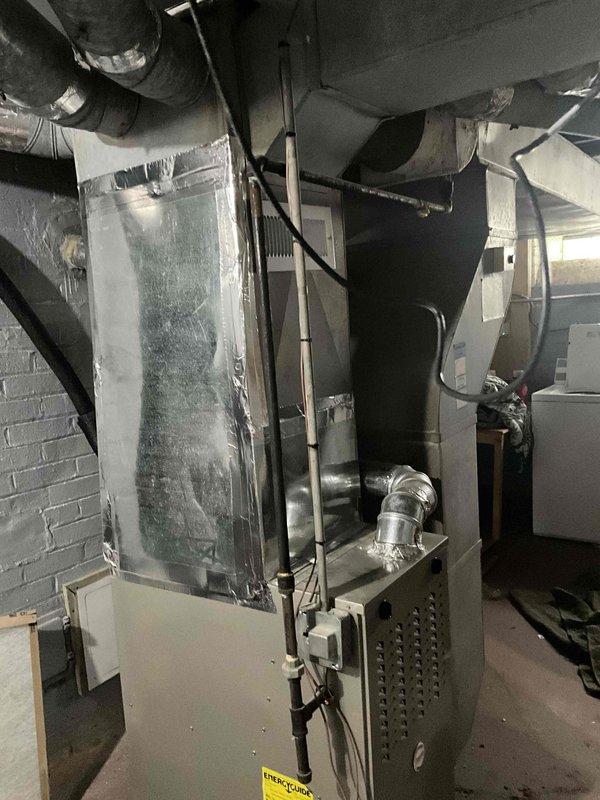 Completed comprehensive HVAC system replacement estimate for residential property. Evaluated existing indoor air handler unit located in basement mechanical room showing signs of frost accumulation and assessed outdoor condensing unit with visible corrosion on fan assembly and rusted central hub. Documented current system configuration including ductwork connections, electrical conduit routing, and refrigerant line placement to provide accurate replacement specifications and ensure proper sizing for new equipment installation.