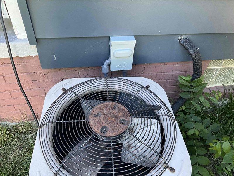 Completed comprehensive HVAC system replacement estimate for residential property. Evaluated existing indoor air handler unit located in basement mechanical room showing signs of frost accumulation and assessed outdoor condensing unit with visible corrosion on fan assembly and rusted central hub. Documented current system configuration including ductwork connections, electrical conduit routing, and refrigerant line placement to provide accurate replacement specifications and ensure proper sizing for new equipment installation.