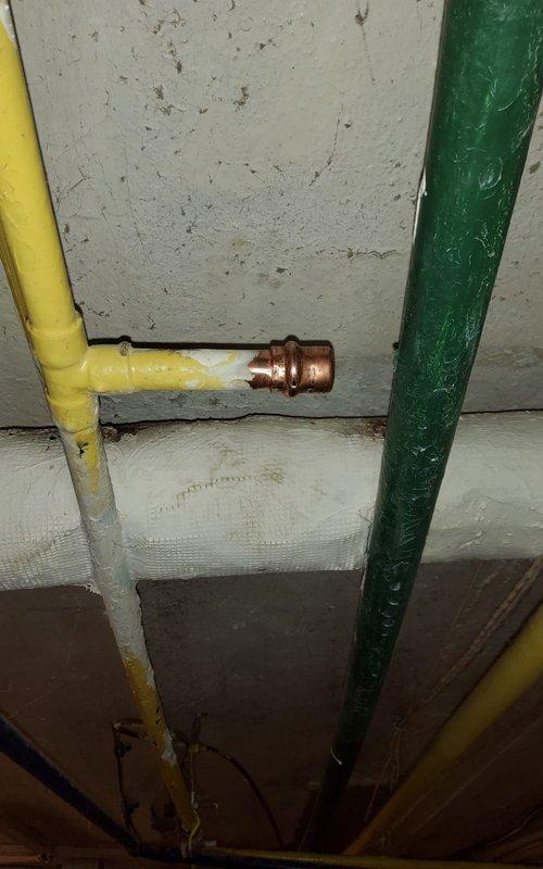 Responded to no cooling complaint at residential property. Upon arrival, conducted system diagnostic and visual inspection of HVAC equipment and ductwork distribution system. Identified active leak in flexible ductwork located in basement utility area, with condensation contributing to minor water accumulation on floor. Inspected exposed mechanical infrastructure including gas lines, copper plumbing connections, and insulated joists for related issues. Documented conditions with photos showing metallic flex duct runs, utility room layout, and areas of concern. Advised customer of ductwork repair requirements to restore proper system operation and prevent continued moisture intrusion.