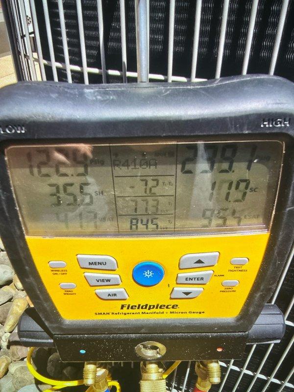 Completed comprehensive cooling tune-up on rooftop air conditioning unit. Accessed unit using extension ladder and performed full system diagnostics including refrigerant pressure and temperature measurements using manifold gauges, verified proper system operation and superheat/subcooling values, and inspected blower motor assembly and housing for proper operation. All components found operating within manufacturer specifications with system pressures and temperatures reading normal across all test points.