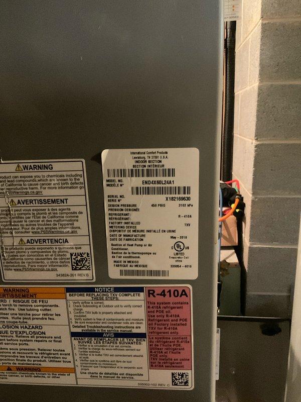 Performed comprehensive preventive maintenance on an 8-year-old air conditioning system located in basement. Completed full system inspection including refrigerant pressure testing using calibrated manifold gauges, verified proper superheat and subcooling levels, and confirmed R-410A refrigerant charge within manufacturer specifications. All safety labels and unit identification verified on model ENDLX06L24A1, system operating within normal parameters with no deficiencies noted.