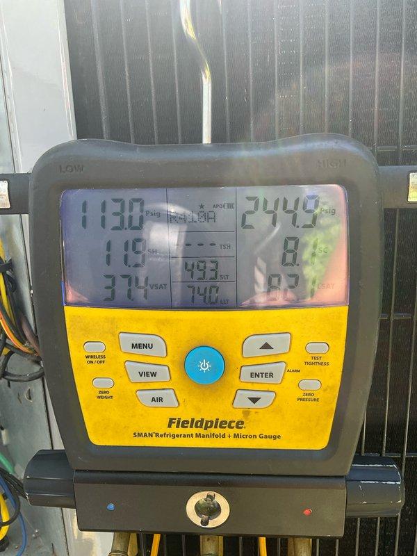 Performed comprehensive preventive maintenance on an 8-year-old air conditioning system located in basement. Completed full system inspection including refrigerant pressure testing using calibrated manifold gauges, verified proper superheat and subcooling levels, and confirmed R-410A refrigerant charge within manufacturer specifications. All safety labels and unit identification verified on model ENDLX06L24A1, system operating within normal parameters with no deficiencies noted.