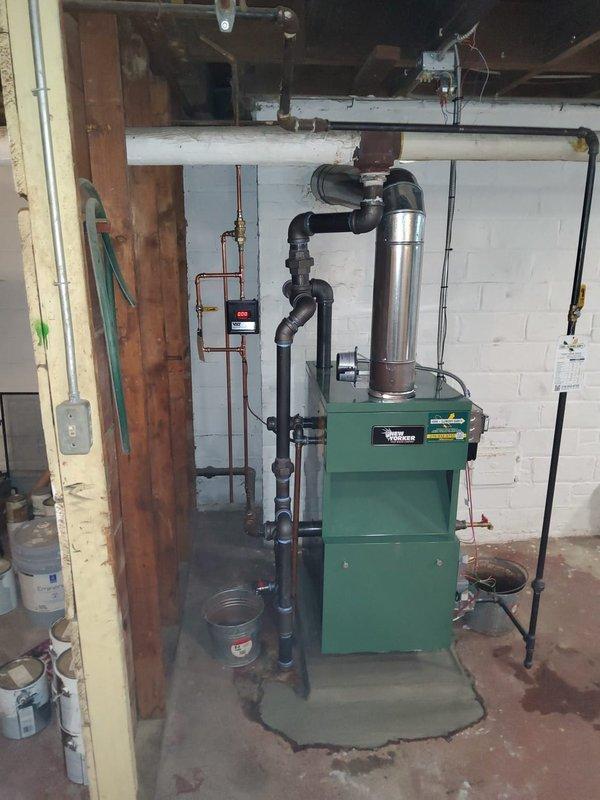 Successfully installed a New Yorker steam boiler model CGS50CNI-H with complete near boiler piping modifications. Installation included new automatic water feeder, low water cutoff, sight glass, pressure control, and backflow preventer, with existing thermostat reused for system control.