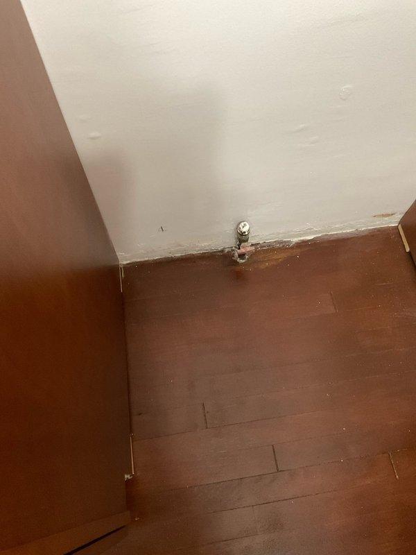 Provided estimate for relocating existing gas line to accommodate stove repositioning. Assessed current gas supply valve location and determined routing requirements for safe installation. Documented existing conditions including wall-mounted shut-off valve and floor layout to plan proper gas line extension and connection points.