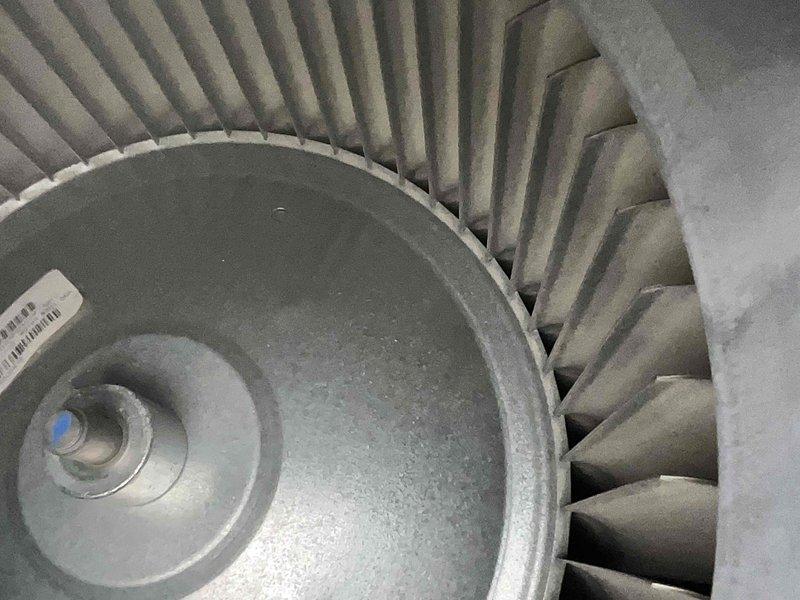 Performed preventive maintenance on two air conditioning systems located behind garage. Conducted thorough inspection of both units, including blower wheel assemblies which showed significant dust and debris accumulation on centrifugal fan blades and motor components. Cleaned blower wheels, checked motor shaft connections, and verified proper operation of all mechanical components to ensure optimal airflow and system efficiency.