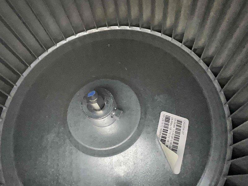 Performed preventive maintenance on two air conditioning systems located behind garage. Conducted thorough inspection of both units, including blower wheel assemblies which showed significant dust and debris accumulation on centrifugal fan blades and motor components. Cleaned blower wheels, checked motor shaft connections, and verified proper operation of all mechanical components to ensure optimal airflow and system efficiency.