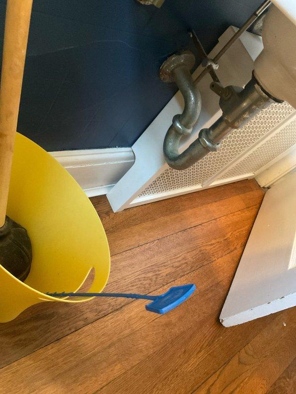 Responded to bathroom sink clog complaint and performed diagnostic assessment. Upon arrival, accessed plumbing system through basement utility area to inspect drainage lines and trap assembly. Identified blockage in drain line, cleared obstruction, and verified proper water flow restoration. System tested and confirmed operational.