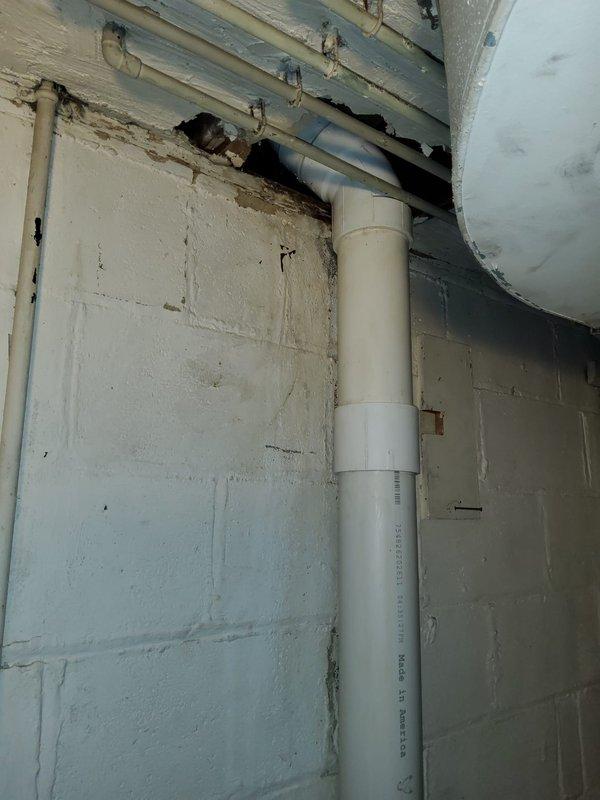 Completed partial stack replacement in basement utility area. Removed section of concrete block wall to access and replace deteriorated horizontal drain lines. Installed new vertical PVC drain stack from floor to ceiling with proper mounting brackets and cleanout access at base. Secured all piping to code specifications and verified proper drainage flow upon completion.