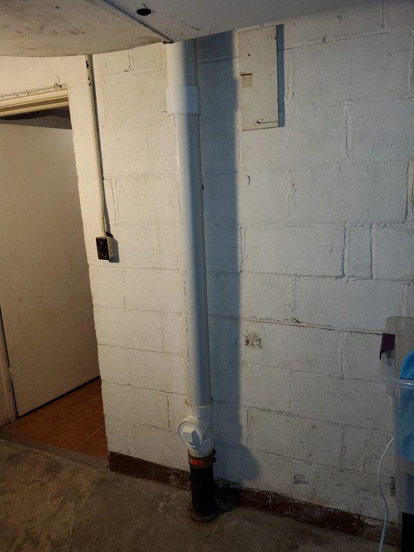 Completed partial stack replacement in basement utility area. Removed section of concrete block wall to access and replace deteriorated horizontal drain lines. Installed new vertical PVC drain stack from floor to ceiling with proper mounting brackets and cleanout access at base. Secured all piping to code specifications and verified proper drainage flow upon completion.