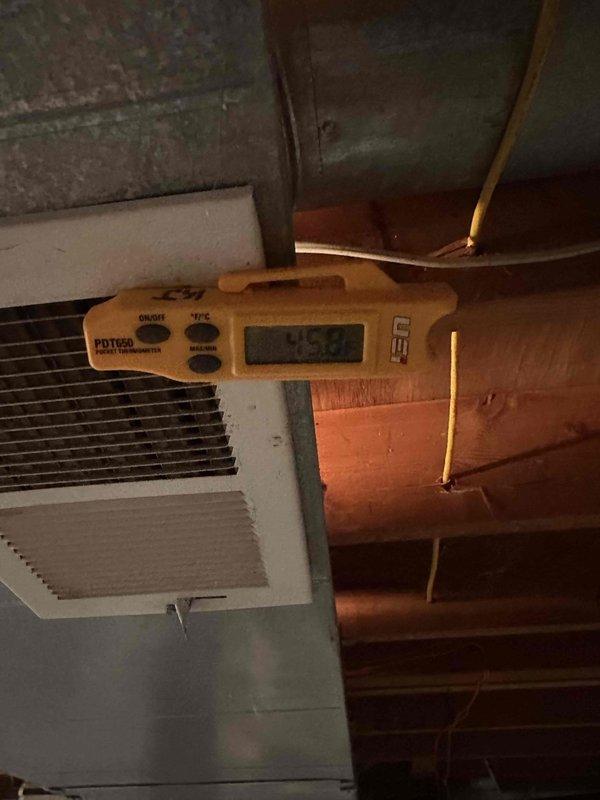Completed full 3-ton air conditioning system replacement. Removed existing outdoor condensing unit and installed new 3-ton A/C system with associated refrigerant line set. Removed obsolete humidifier from existing ductwork and properly patched opening to restore system integrity. Connected new refrigerant lines with white foam insulation to indoor air handler unit. Verified proper electrical connections and control wiring between components. Tested system operation and confirmed supply air temperature of 45°F at register, indicating proper refrigerant charge and cooling performance. System commissioned and left in operational condition.