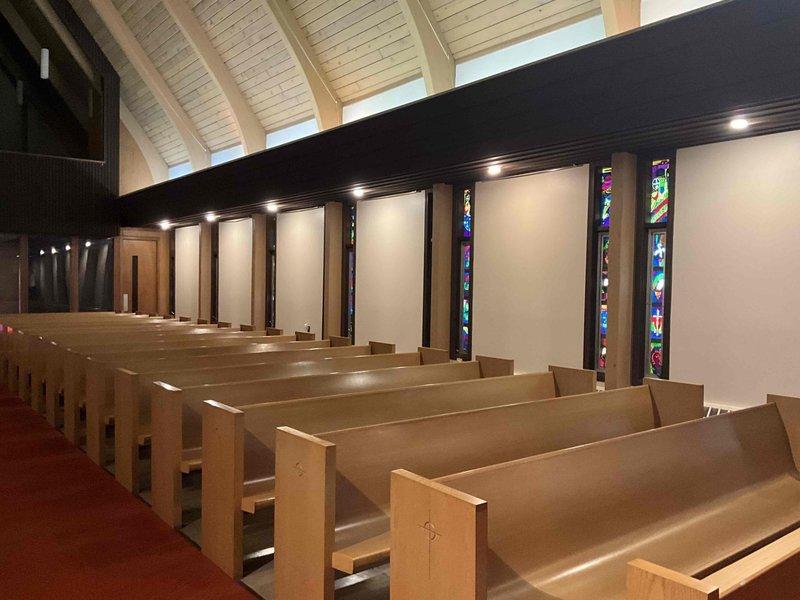 Confirmed appointment for mini split system estimate update at church facility, following up on previous quote from one year prior. Conducted site assessment and photographed sanctuary space to evaluate HVAC requirements for the vaulted ceiling architecture, stained glass windows, and open worship area with wooden pews and organ installation.