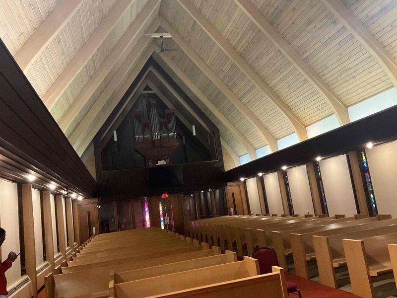 Confirmed appointment for mini split system estimate update at church facility, following up on previous quote from one year prior. Conducted site assessment and photographed sanctuary space to evaluate HVAC requirements for the vaulted ceiling architecture, stained glass windows, and open worship area with wooden pews and organ installation.