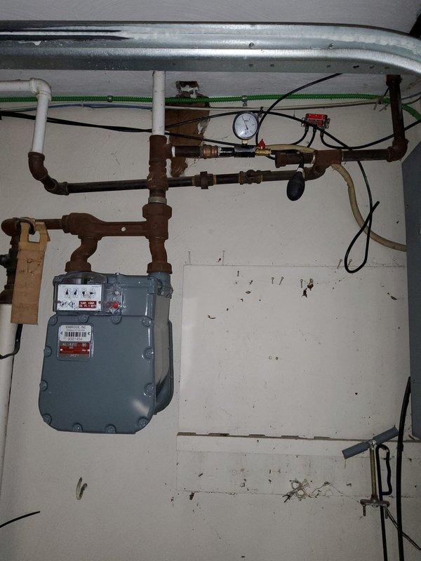 Replaced existing half-inch grease valve with a ball valve on the gas line serving the stove, removed a secondary grease valve, and properly capped the 3/8-inch line. Following the modifications, performed a comprehensive pressure test on the gas system to verify integrity and confirm no leaks were present at any connections or joints.