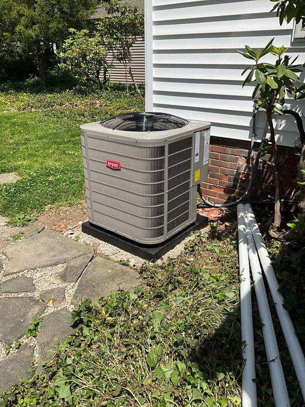 Completed full HVAC system installation including new Bryant furnace in basement mechanical room and outdoor air conditioning condenser unit. Installed condenser on plastic pad adjacent to building exterior with proper clearances, connected refrigerant lines, and established electrical service. Inside mechanical room, positioned furnace unit with vertical supply ductwork extending to distribution system and integrated return air connections to tie back existing returns. Tested system operation, verified proper airflow, checked refrigerant charge, and confirmed all safety controls functioning correctly.