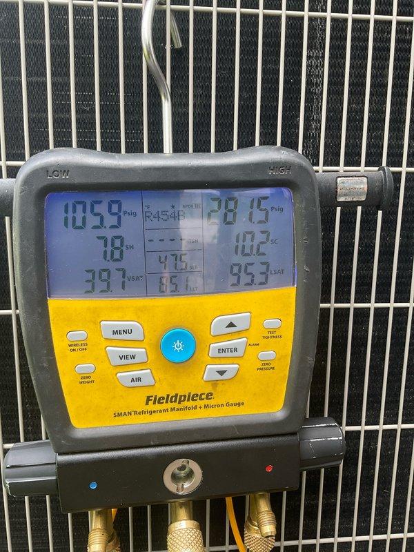 Performed comprehensive tune-up on one-year-old residential air conditioning system utilizing R-454B refrigerant. Conducted diagnostic testing with refrigerant manifold and micron gauge, confirming system operating within manufacturer specifications with suction pressure at 105.9 psig, liquid line pressure at 78.15 psig, and superheat reading of 10.2°F. Inspected condenser unit exterior components, verified all safety labels and manufacturer specifications intact, and confirmed Energy Star certified unit functioning properly with no deficiencies noted.