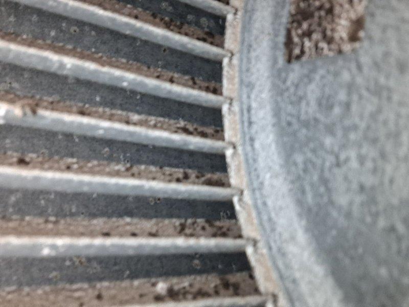 Completed comprehensive AC tune-up service on residential air conditioning system with no reported issues. Performed standard preventive maintenance procedures including temperature diagnostics on outdoor condenser unit, recording discharge temperature of 138°F, and inspection of return air grille which showed moderate dust and debris accumulation along slats and frame edges. All system components checked and unit operating within normal parameters.